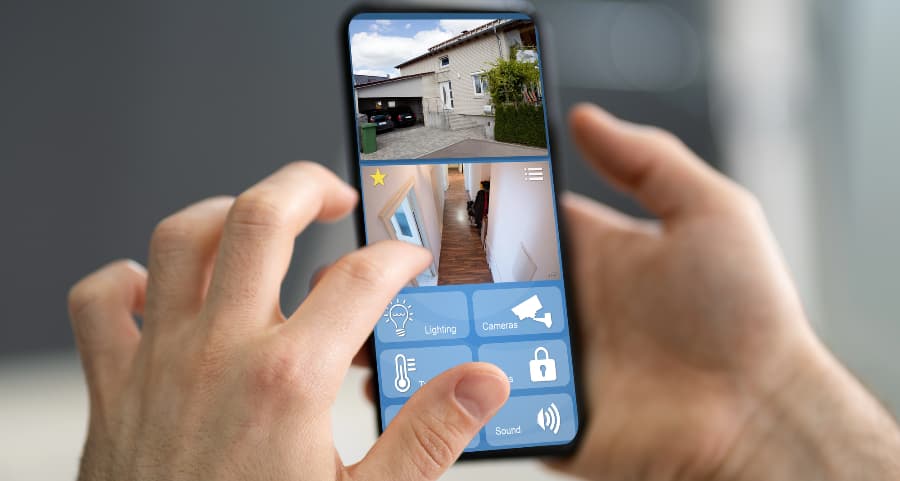 Resident checking surveillance camera feeds on a smartphone